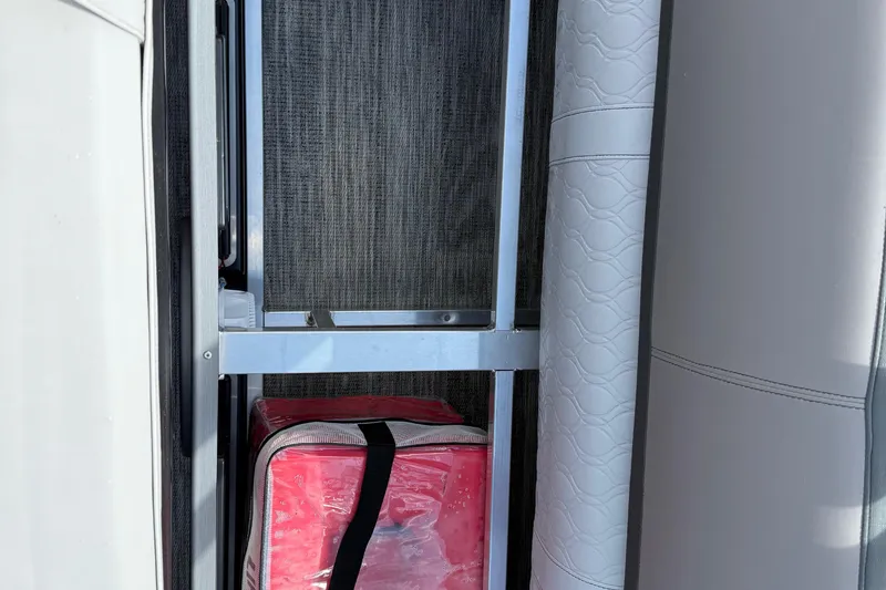 Slide: The Image of Storage compartment in 2022 Avalon Catalina VRL - 25' boat with red bag. - 40