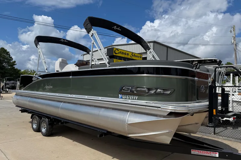 Slide: The Image of 2022 Avalon Catalina VRL 25' pontoon boat on trailer, outdoor dealership setting. - 44