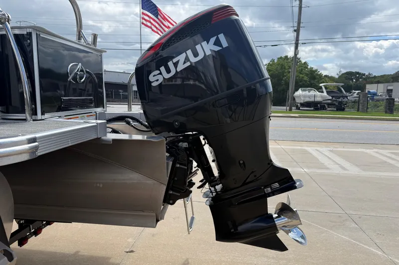 Slide: The Image of 2022 Avalon Catalina VRL boat with Suzuki outboard motor, American flag in background. - 6