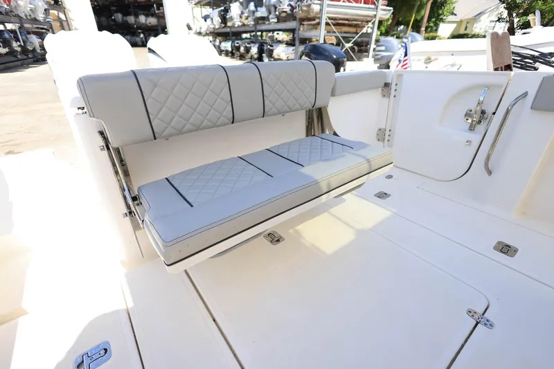 Slide: The Image of 2022 Pursuit S 288 Sport boat with foldable cushioned seating. - 11