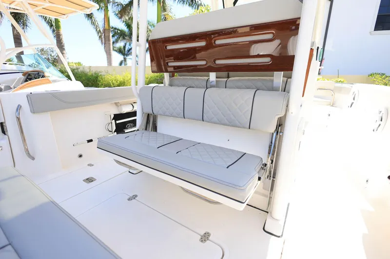 Slide: The Image of 2022 Pursuit S 288 Sport boat interior with foldable seating and elegant design. - 13