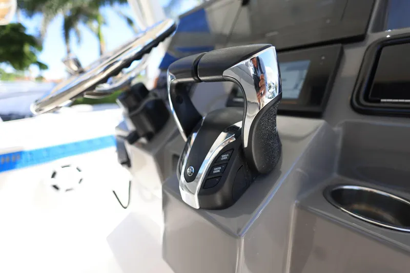 Slide: The Image of Close-up of 2022 Pursuit S 288 Sport boat controls and steering wheel. - 20