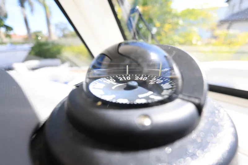 Slide: The Image of Compass on 2022 Pursuit S 288 Sport boat, close-up view. - 22