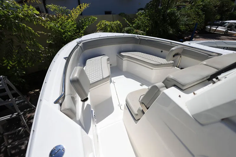 Slide: The Image of 2022 Pursuit S 288 Sport boat interior with cushioned seating and sleek design. - 25