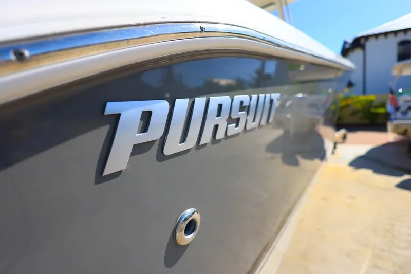 Slide: The Image of 2022 Pursuit S 288 Sport boat with sleek design and chrome lettering. - 42