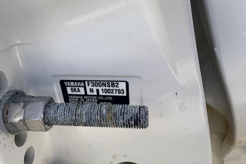 Slide: The Image of Close-up of Yamaha F300NSB2 engine label on Pursuit S 288 Sport, 2022 model. - 45