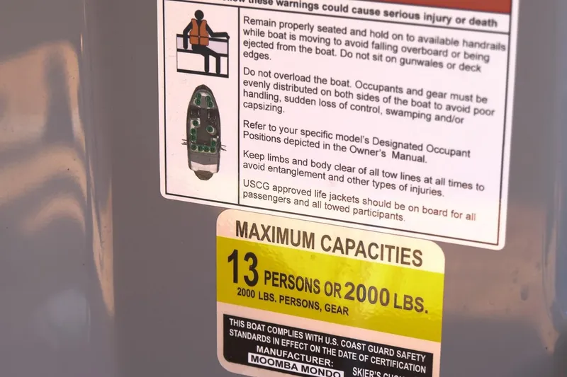 Slide: The Image of 2023 Moomba Mondo boat capacity label, maximum 13 persons or 2000 lbs. - 13
