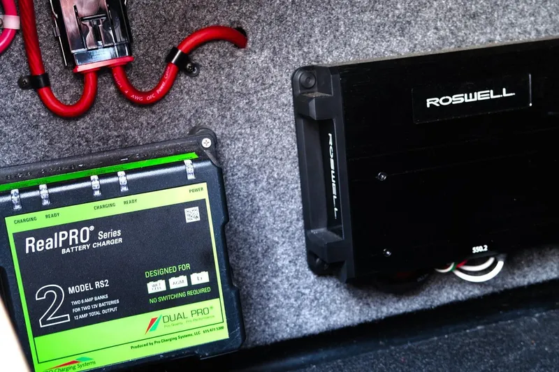 Slide: The Image of 2023 Moomba Mondo battery charger and amplifier setup with RealPRO and Roswell components. - 14