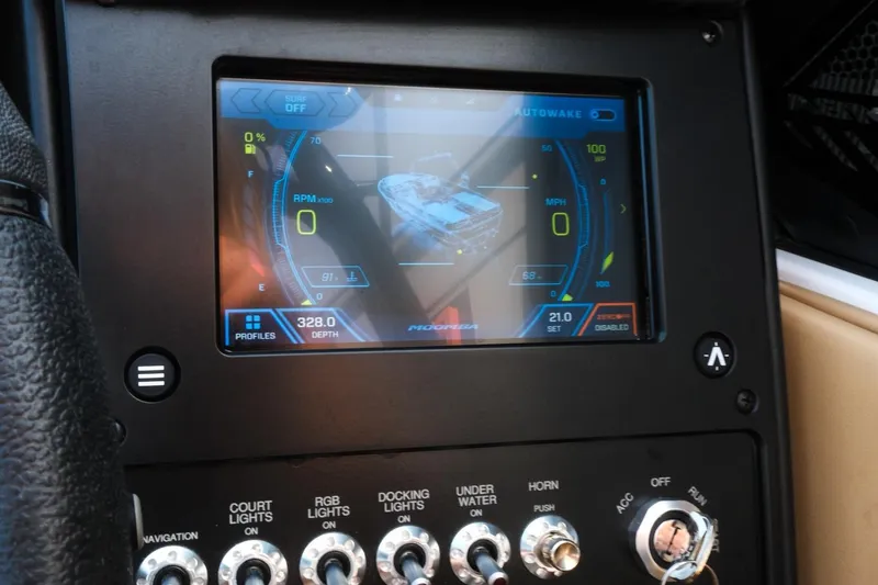 Slide: The Image of 2023 Moomba Mondo dashboard display with navigation and control switches. - 16