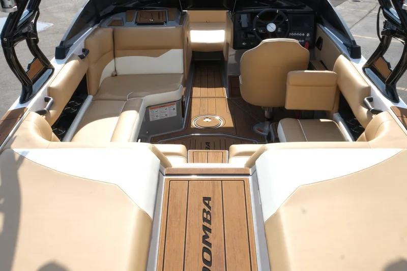 Slide: The Image of 2023 Moomba Mondo boat interior with tan seating and sleek design. - 27