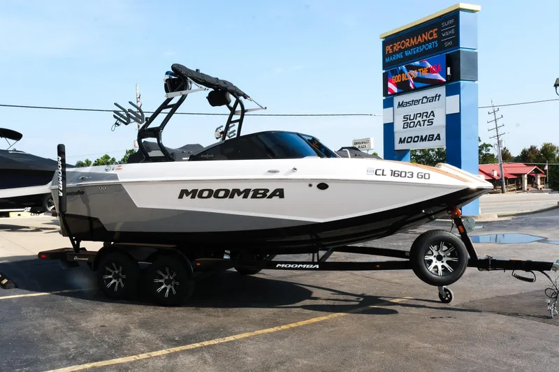 Slide: The Image of 2023 Moomba Mondo boat on trailer at Performance Marine Watersports dealership. - 5