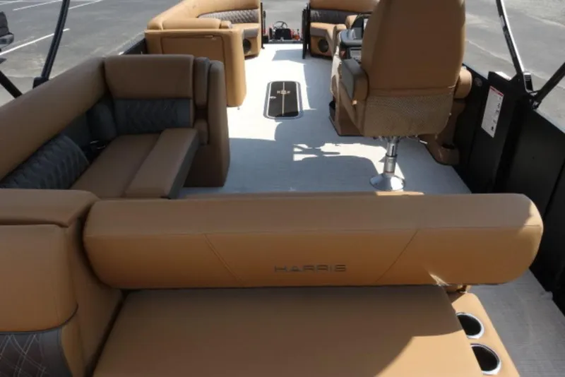 Slide: The Image of 2025 Harris Cruiser 250 LUX interior with luxurious tan seating and modern design. - 13