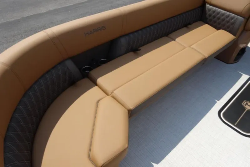 Slide: The Image of Luxurious seating on 2025 Harris Cruiser 250 LUX pontoon boat, featuring tan upholstery. - 6