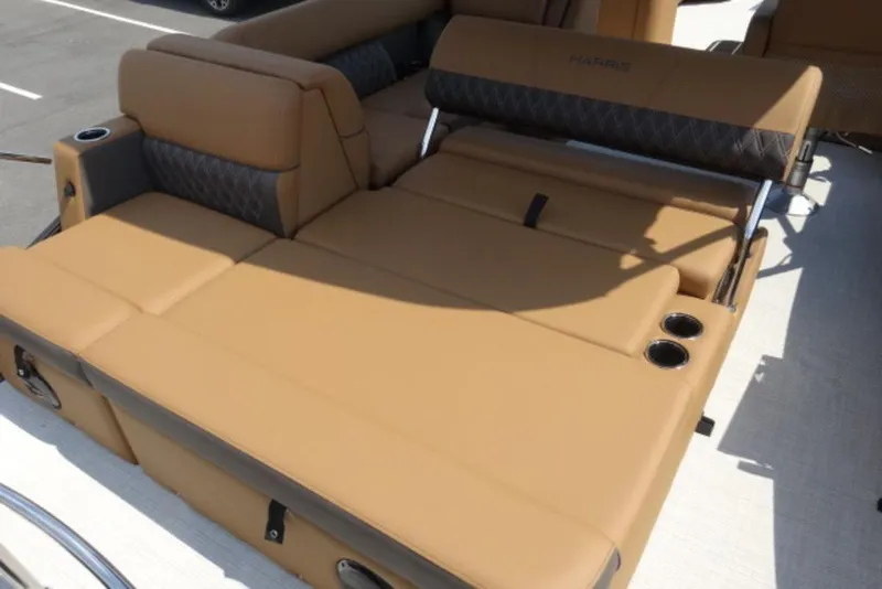 Slide: The Image of Luxurious tan seating on 2025 Harris Cruiser 250 LUX boat, featuring cup holders. - 8