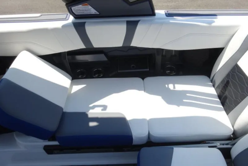 Slide: The Image of Interior seating of 2026 Malibu 23 MXZ boat with modern design and comfortable cushions. - 1