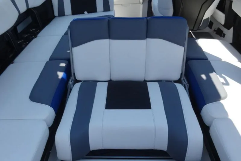 Slide: The Image of 2026 Malibu 23 MXZ boat interior with stylish blue and white seating. - 7