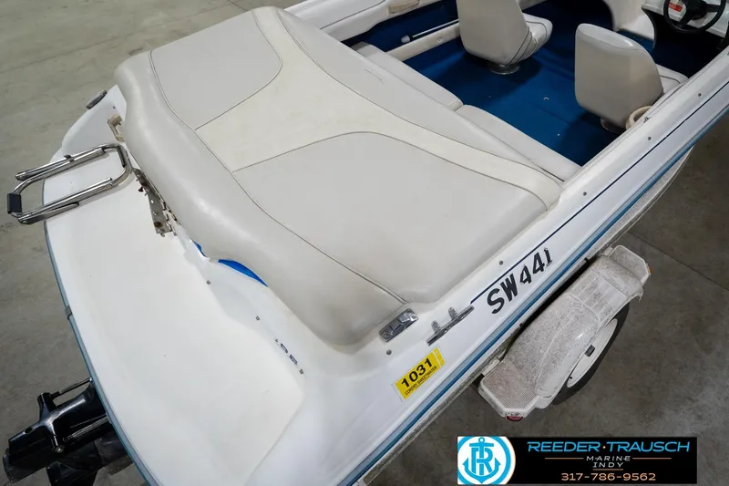 Slide: The Image of 1995 Sea Ray 175 Bow Rider boat interior with white seating, showcased by Reeder-Trausch Marine. - 13