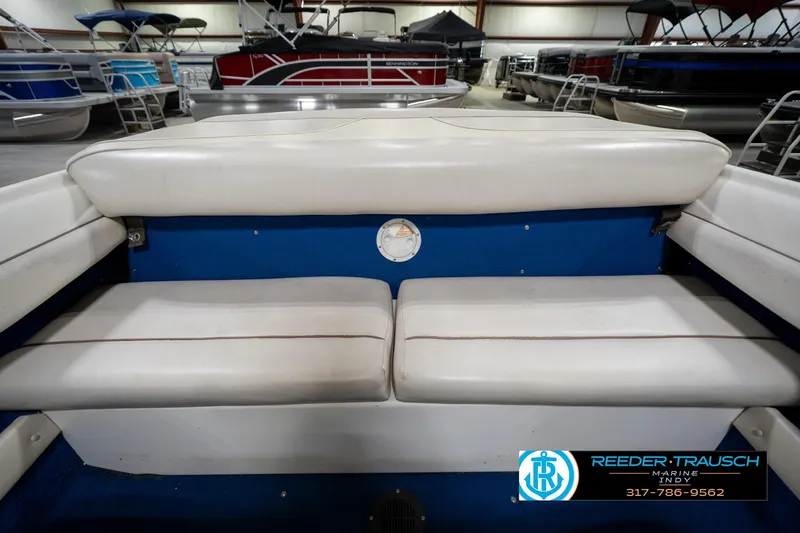 Slide: The Image of Interior view of 1995 Sea Ray 175 Bow Rider boat in a garage. - 18