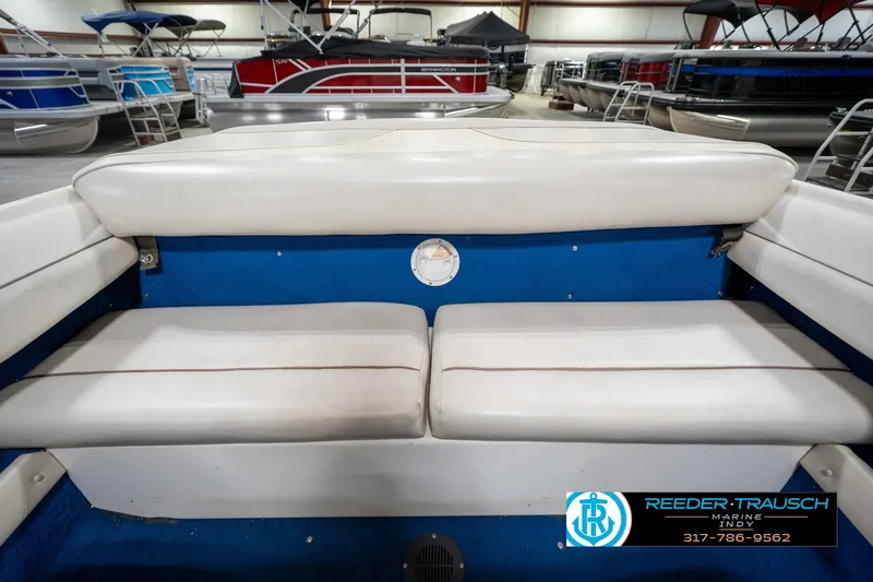 Slide: The Image of 1995 Sea Ray 175 Bow Rider dashboard with glove compartment and cup holder. - 23