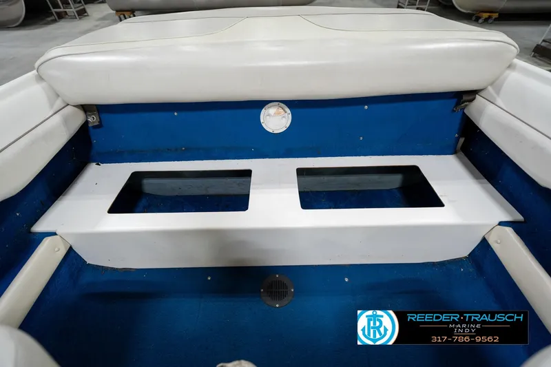 Slide: The Image of 1995 Sea Ray 175 Bow Rider dashboard with stereo system, beige interior, and windshield. - 24