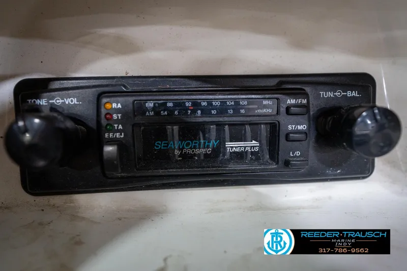Slide: The Image of 1995 Sea Ray 175 Bow Rider dashboard with temperature and voltage gauges, switches, and logo. - 32