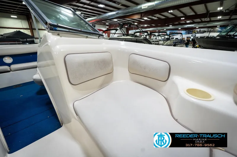 Slide: The Image of 1995 Sea Ray 175 Bow Rider interior with white seating and blue carpet. - 35