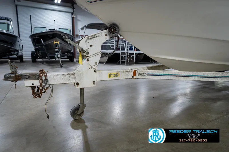 Slide: The Image of Sea Ray 175 Bow Rider 1995 logo on boat hull, Reeder-Trausch Marine branding. - 46