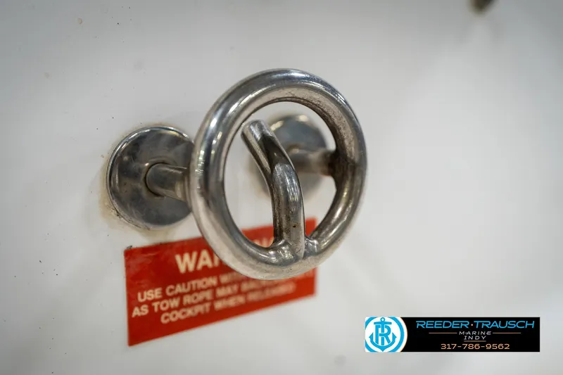 Slide: The Image of Chrome cleat on a 1995 Sea Ray 175 Bow Rider boat deck. - 48