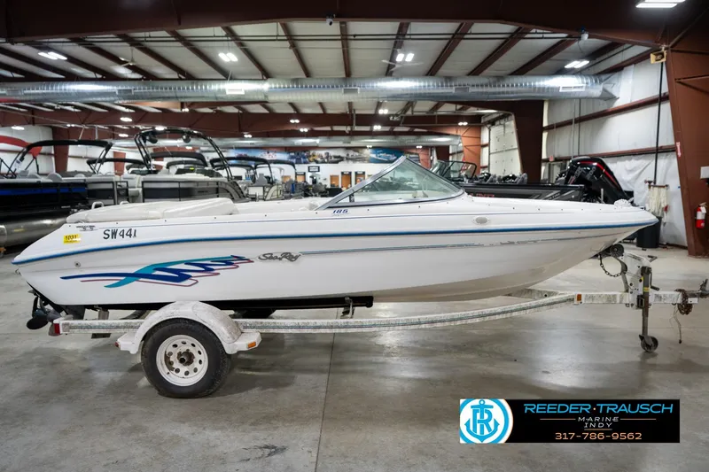 Slide: The Image of 1995 Sea Ray 175 Bow Rider boat on trailer in indoor showroom. - 6