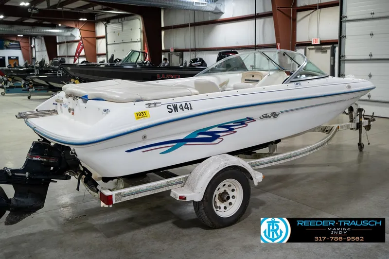 Slide: The Image of 1995 Sea Ray 175 Bow Rider boat on trailer in indoor showroom. - 7