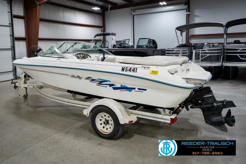 Slide: The Image of 1995 Sea Ray 175 Bow Rider boat in a garage, rear view. - 9