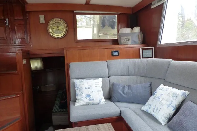 Slide: The Image of Interior of 1987 Marine Trader Sundeck with cozy seating and nautical decor. - 20