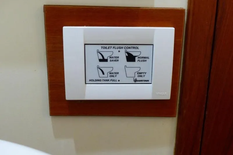 Slide: The Image of Toilet flush control panel on 1987 Marine Trader Sundeck boat. - 30