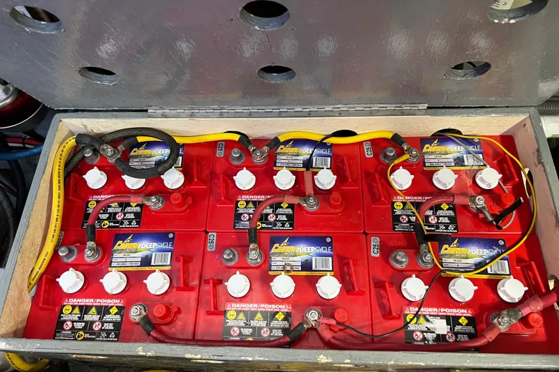Slide: The Image of Battery compartment of a 1987 Marine Trader Sundeck, featuring Crown deep cycle batteries. - 41
