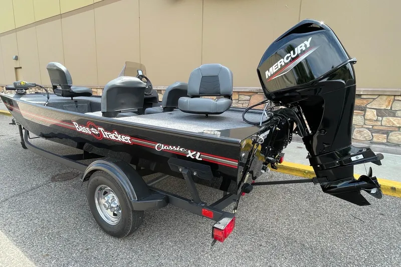 Slide: The Image of 2024 Tracker Bass Tracker Classic XL boat with Mercury engine on trailer. - 2