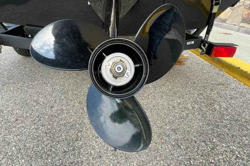 Slide: The Image of 2024 Tracker Bass Tracker Classic XL boat propeller on asphalt surface. - 4