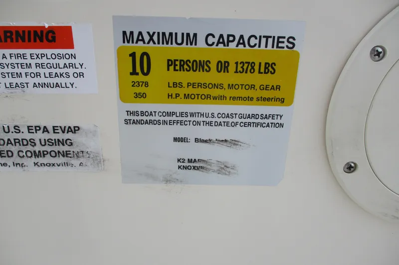Slide: The Image of Warning label on 2016 BlackJack 256 Bay boat showing maximum capacity and safety compliance. - 11