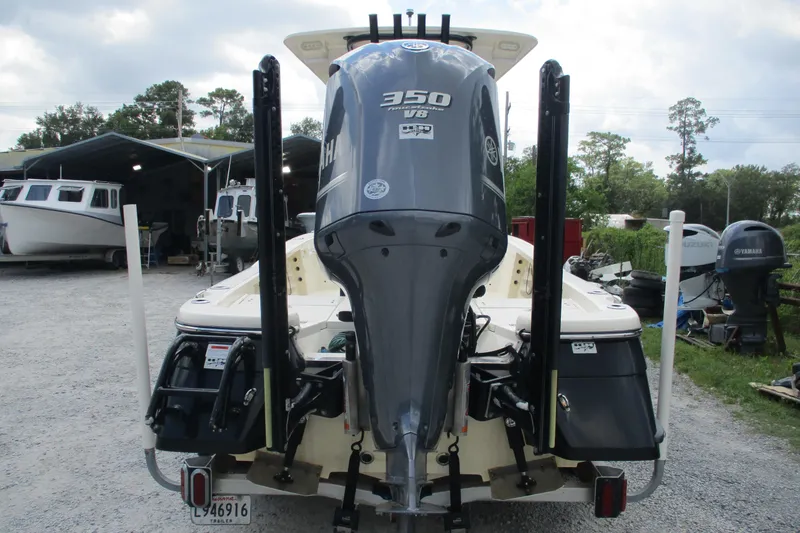 Slide: The Image of 2016 BlackJack 256 Bay boat with Yamaha 350 V8 engine, parked in a marina. - 5