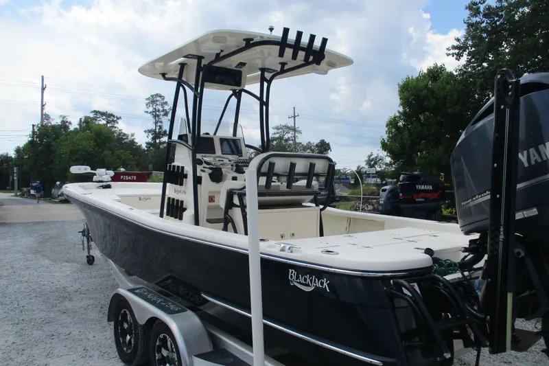 Slide: The Image of 2016 BlackJack 256 Bay boat on trailer with Yamaha outboard motor. - 6
