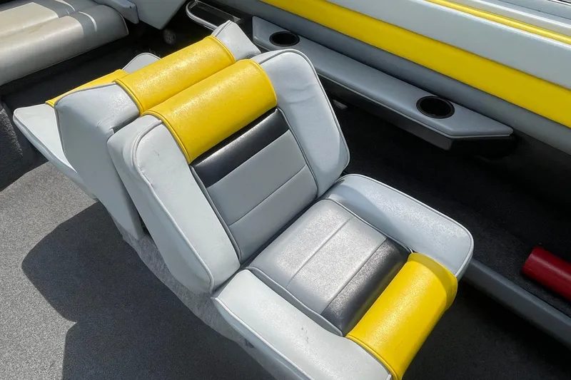 Slide: The Image of 1988 Donzi Open Bow boat seat with yellow and gray upholstery. - 14