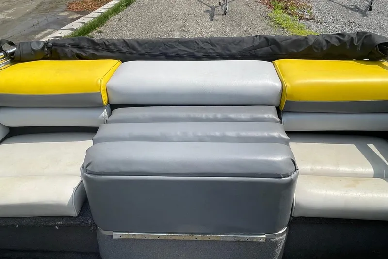 Slide: The Image of 1988 Donzi Open Bow boat interior with yellow and gray cushioned seating. - 15