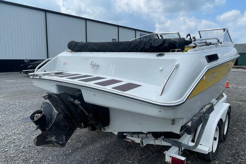 Slide: The Image of 1988 Donzi Open Bow boat on trailer, rear view, parked outdoors. - 3