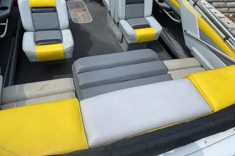 Slide: The Image of 1988 Donzi Open Bow boat interior with yellow and gray seating. - 8