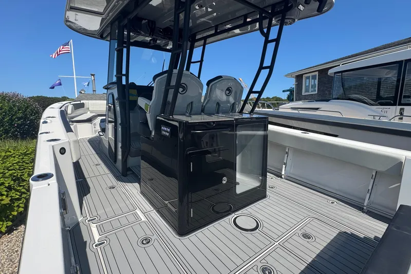 Slide: The Image of 2025 Edgewater 340CC boat interior with sleek design and stainless steel hinges. - 14