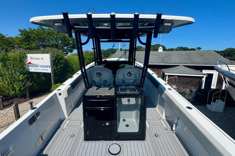 Slide: The Image of 2025 Edgewater 340CC boat with sleek deck design and modern features. - 15