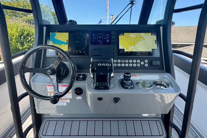 Slide: The Image of 2025 Edgewater 340CC boat with dual sinks and storage on deck. - 21