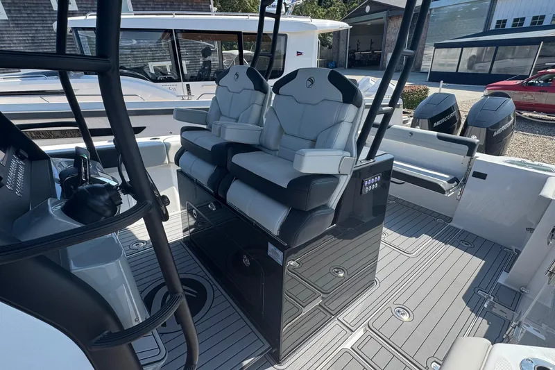 Slide: The Image of 2025 Edgewater 340CC boat interior with dual seats and modern design. - 27
