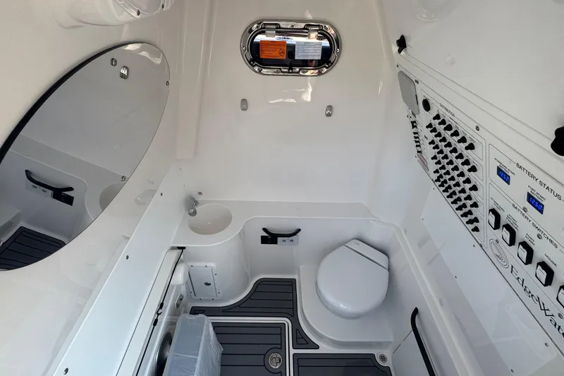 Slide: The Image of 2025 Edgewater 340CC boat interior with dual captain seats and modern dashboard. - 28