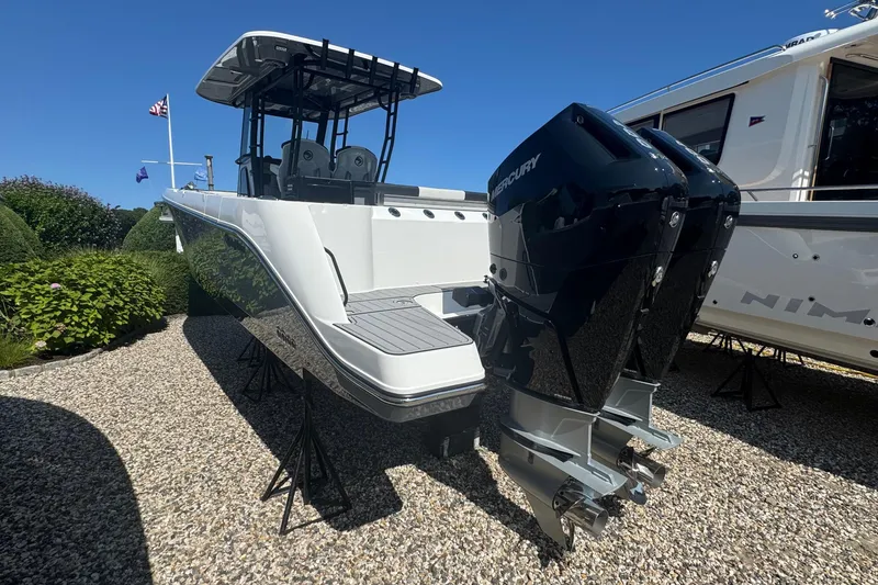 Slide: The Image of Aerial view of 2026 Edgewater 340CC boat on calm green water. - 4