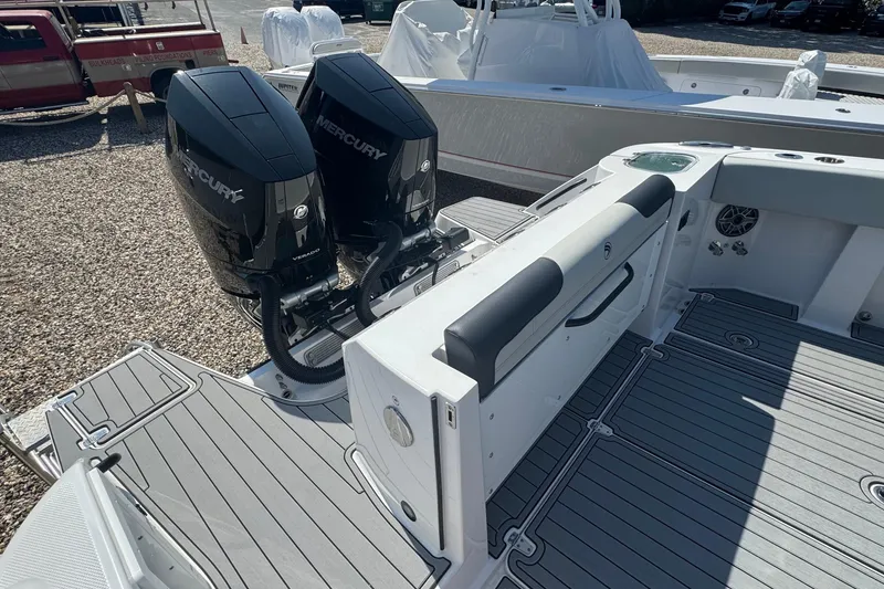 Slide: The Image of 2025 Edgewater 340CC boat with twin 400 V10 engines at Modern Yachts dealership. - 7